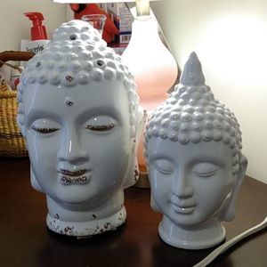 2 Budda Heads. Both Ceramic. One holds a Tealight
